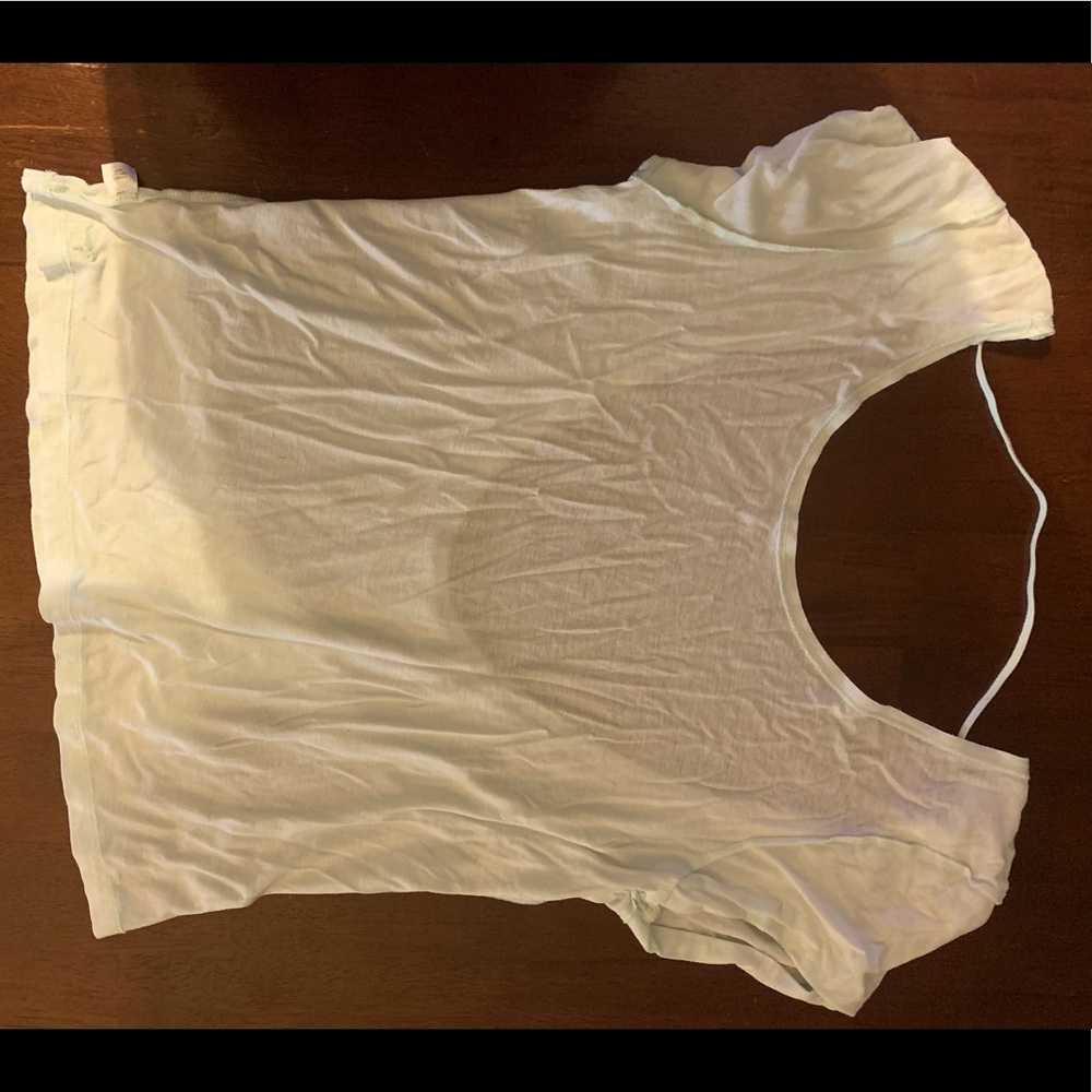 Low cut, open back shirt